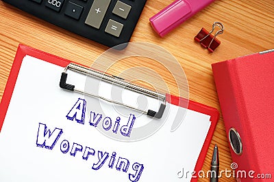 Business concept about Avoid Worrying with phrase on the piece of paper Stock Photo