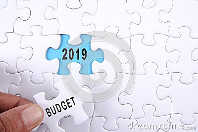 Business concept: 2019 BUDGET word on a jigsaw puzzle background Stock Photo