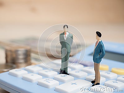 Business Concept. businessman small figures standing on calcula Stock Photo