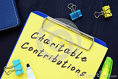 Business concept about Charitable Contributions with sign on the page Stock Photo