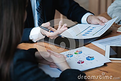 Business concept. Close up. Businessman advice to team with paperwork to analyzing budget plan and statistic Stock Photo