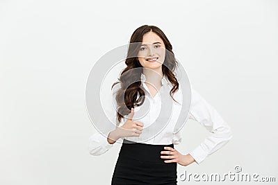 Business Concept: Confident young cheerful woman showing thumb up. Isolated over grey copy space background. Stock Photo