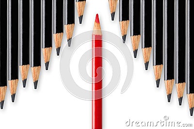 Business concept of disruption, leadership or think different; red pencil dividing row of black pencils in opposite direction Stock Photo