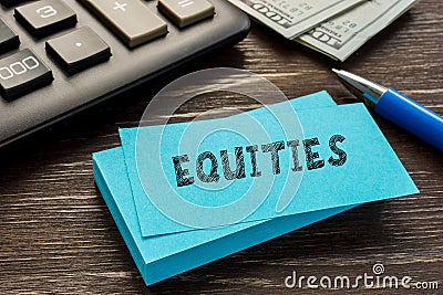 Business concept about EQUITIES with inscription on the sheet Stock Photo