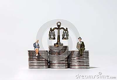 A business concept expressed in miniature and coins. Stock Photo