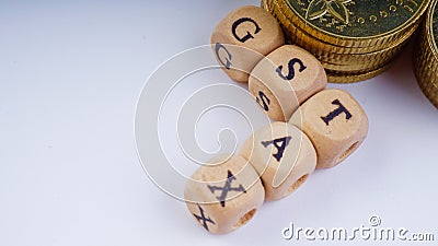 Business Concept with a GST word on stacked coins. Stock Photo