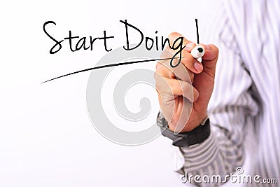 Business concept image of a hand holding marker and write dont start doing isolated on white Stock Photo