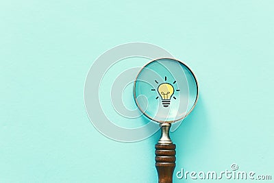 Business concept image. Magnifying glass and lamp. Finding the best idea and inspiration among others Stock Photo