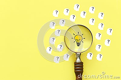 Business concept image. Magnifying glass and lamp. Finding the best idea and inspiration among others Stock Photo