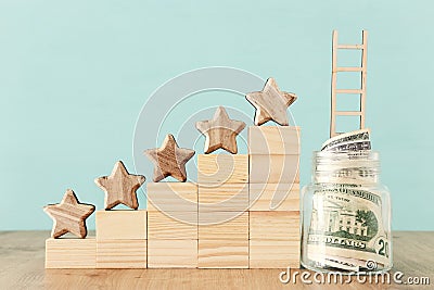 Business concept image of setting a five star goal. increase rating or ranking, evaluation, money investment and financial growth Stock Photo