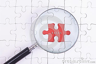 Business Concept - Magnifier Glass on white puzze with sales Word Stock Photo