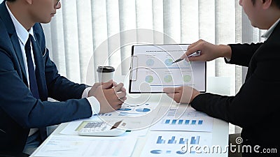 Business concept a male sale representative explaining the information of the companyâ€™s sale to a male client Stock Photo