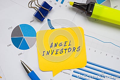 Business concept meaning ANGEL INVESTORS with sign on the piece of paper Stock Photo