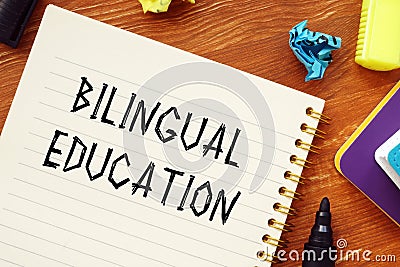 Business concept meaning BILINGUAL EDUCATION question marks with phrase on the piece of paper Stock Photo
