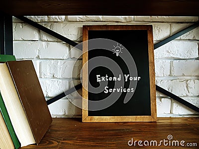 Business concept meaning Extend Your Services S with inscription on the sheet Stock Photo