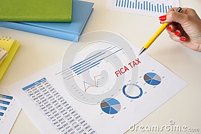 Business concept meaning FICA TAX Federal Insurance Contributions Act with sign on the page Stock Photo