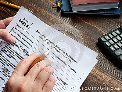 Business concept meaning Form 8453-X Political Organization Declaration for Electronic Filing of Notice of Section 527 Status with Stock Photo