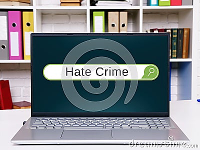 Business concept meaning Hate Crime with phrase on the piece of paper Stock Photo