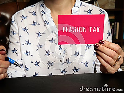 Business concept meaning PENSION TAX with sign on the page. A retirement plan that requires an employer to make contributions to a Stock Photo