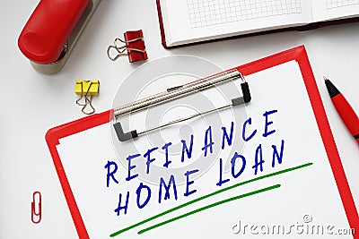 Business concept meaning REFINANCE HOME LOAN with phrase on the piece of paper Stock Photo