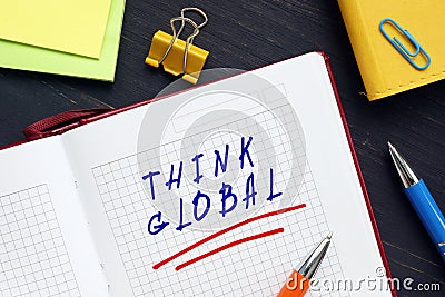 Business concept meaning THINK GLOBAL with phrase on the sheet. The leaders and managers should think ahead of their time, and Stock Photo