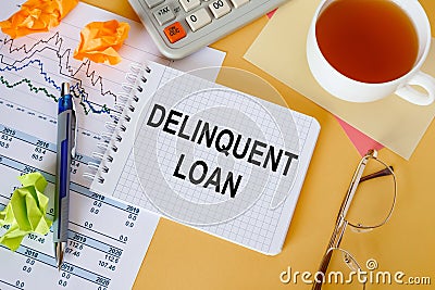 Business concept - notebook writing Delinquent loan Stock Photo