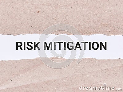 Business concept. Phrase risk mitigation written on paper strip. Stock Photo