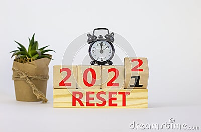 Business concept of planning 2022 reset symbol. Turned a wooden cube and changed words `Reset 2021` to `Reset 2022`. Beautiful Stock Photo