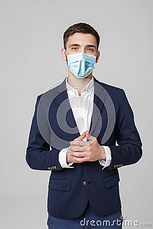 Business Concept - portrait young successful businessman in face mask osing over dark background. Copy space. Stock Photo