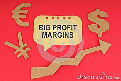 On the red surface there are money symbols, an arrow and a sign with the inscription - Big Profit Margins Stock Photo