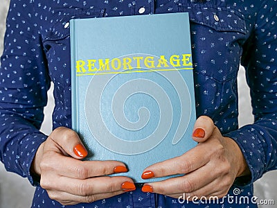 Business concept about REMORTGAGE with sign on the piece of paper Stock Photo