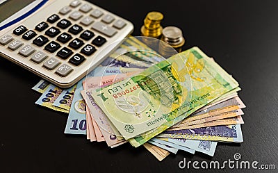 Business concept, Romanian currency on black table. LEI banknotes, coins and calculator Stock Photo