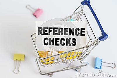 In the shopping cart, the text is written on the card - REFERENCE CHECKS Stock Photo