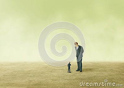 Small businessman looking at big businessman and thinking something. Stock Photo