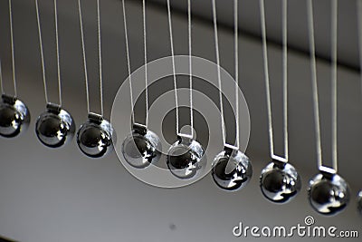 Business concept for strategy team work and alignment. Newtons Cradle Pendulum Stock Photo