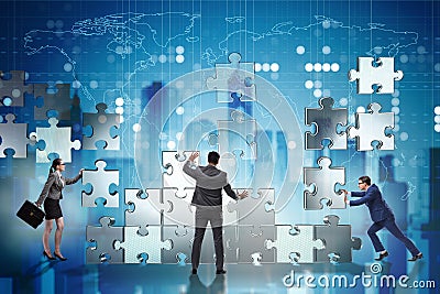 The business concept of teamwork with puzzle pieces Stock Photo