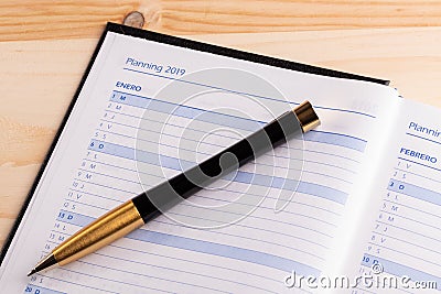 Business concept - Top view of an open notebook hardcover diary with the word 2019 Stock Photo