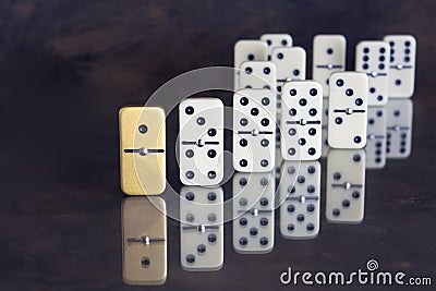 Business concept - Unique domino standing out from the rest Stock Photo