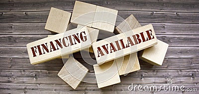 wooden background blocks with the text Financing Available Stock Photo