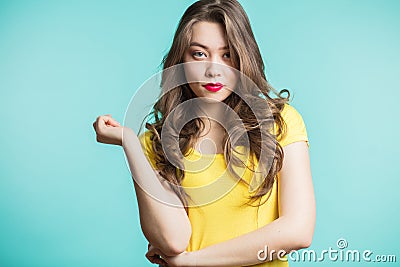 Business and confident woman looking at the camera on a blue background. Stock Photo