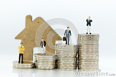 Business consultants on financial transactions for home loan, miniature people. Image use for financial, business concept Stock Photo