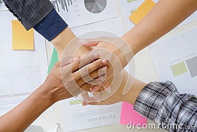 business cooperate hands join on office desk. Stock Photo