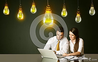 Business couple with idea bulbs Stock Photo