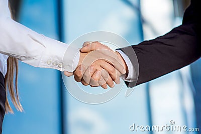 Business couple shaking hands outdoors Stock Photo