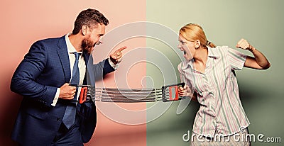 Business couple spring expander. property division. man against woman. battle between male and female. double standards Stock Photo