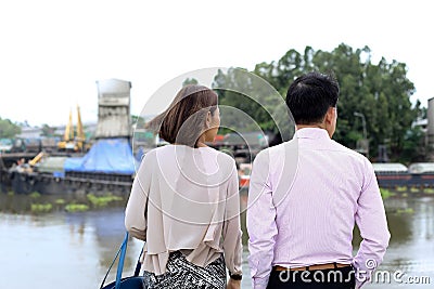 Business couple standing and looking at construction site Editorial Stock Photo