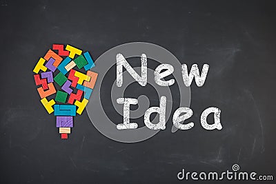 Business creative idea concept - inscription and jigsaw blocks on the blackboard Stock Photo