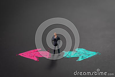 Business decision, career or opportunity option in life to choose concept, miniature businessman thinking in the middle of left re Stock Photo