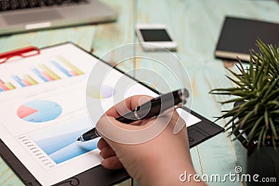 Photo diagrams graphs and numerals in the table on the paper Stock Photo