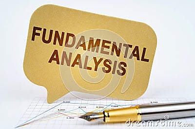 On the business diagram is a pen and a sign with the inscription - FUNDAMENTAL ANALYSIS Stock Photo